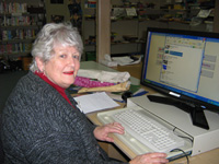 This volunteer assists in the school library.